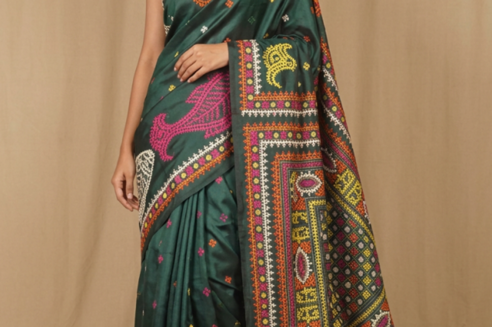 Semi Bangalore silk saree with all-over hand Kantha work and rich embroidered pallu.
