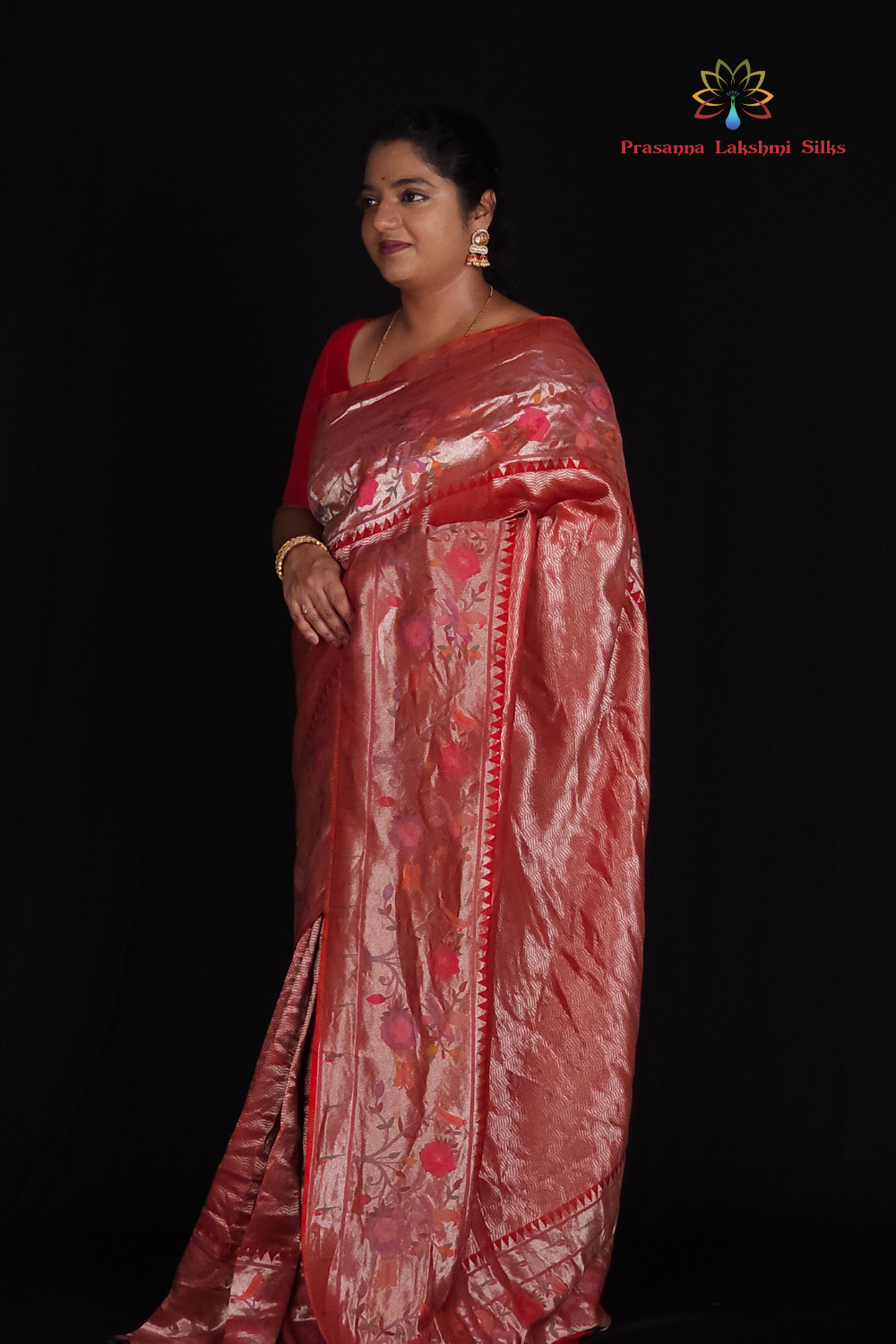 "Red Ptissue saree with floral pallu and running blouse"