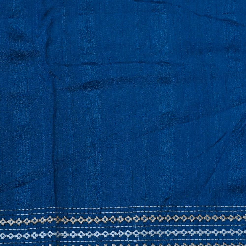 Elegant thread embroidered saree featuring rich Kutch work pallu and running blouse piece.
