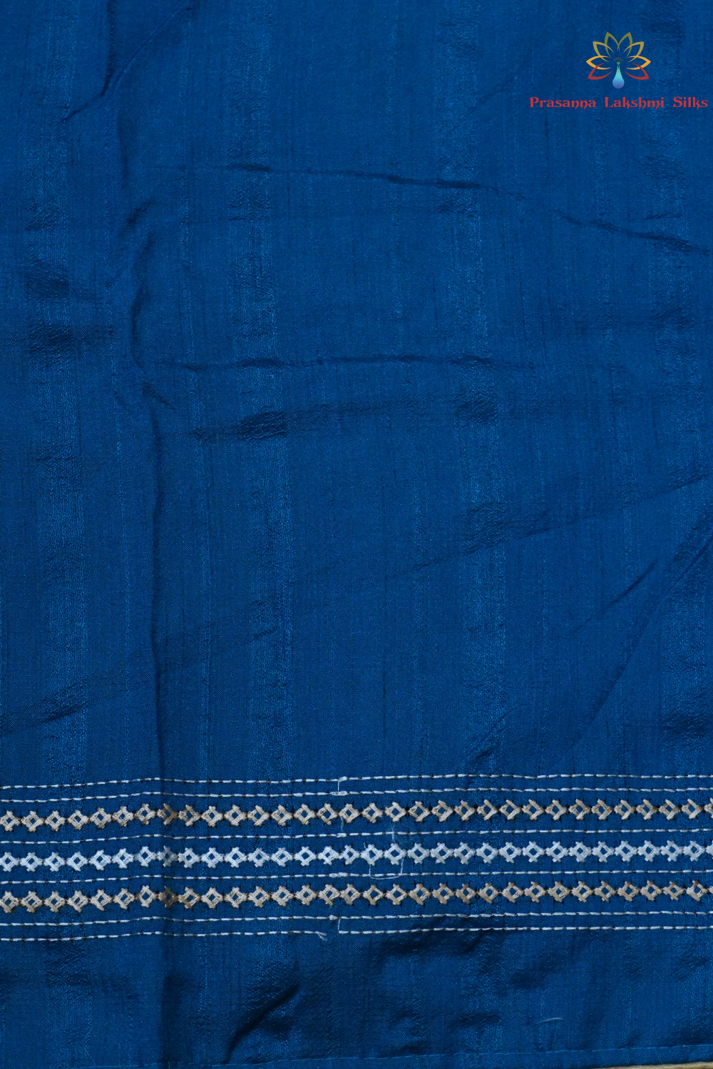 Elegant thread embroidered saree featuring rich Kutch work pallu and running blouse piece.
