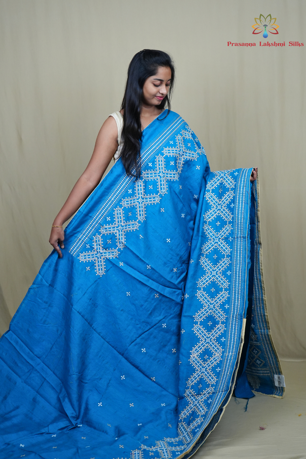 Traditional semi Tussar saree suitable for festive occasions with intricate Kutch work detailing.