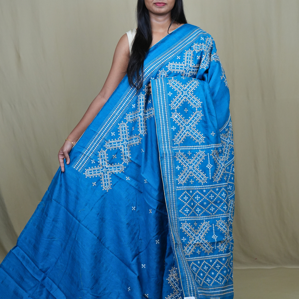 Semi Tussar silk saree with all-over small Kutch work motifs and beautiful borders.
