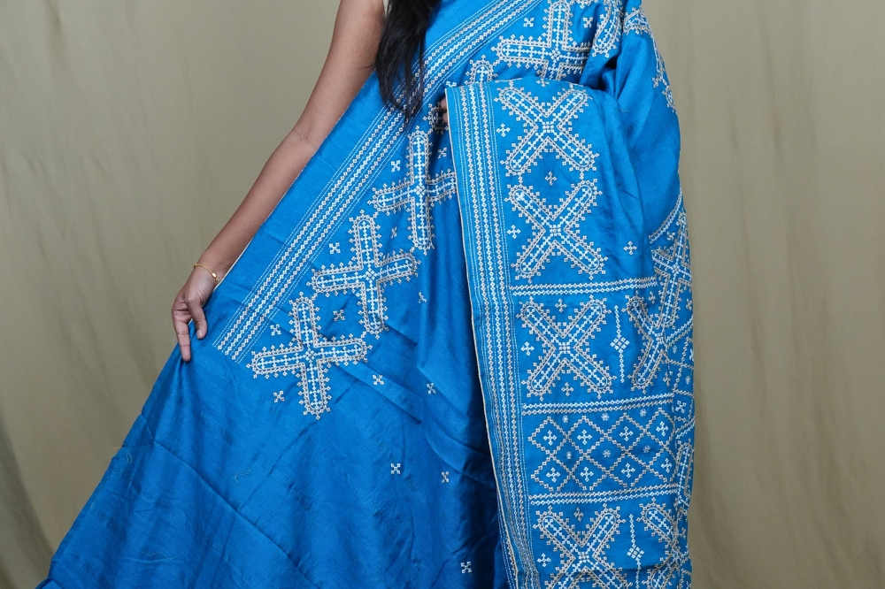 Semi Tussar silk saree with all-over small Kutch work motifs and beautiful borders.

