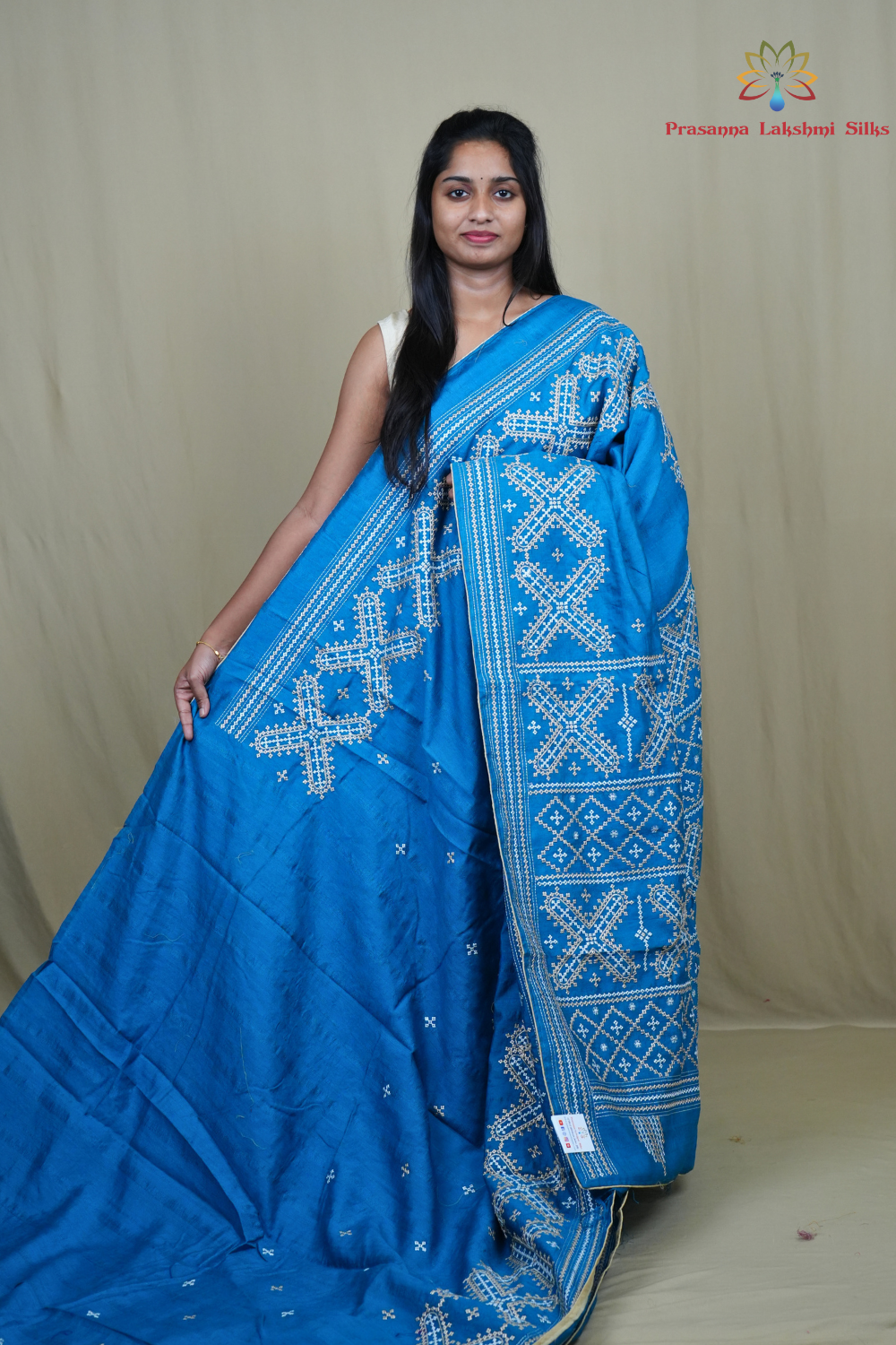 Semi Tussar silk saree with all-over small Kutch work motifs and beautiful borders.
