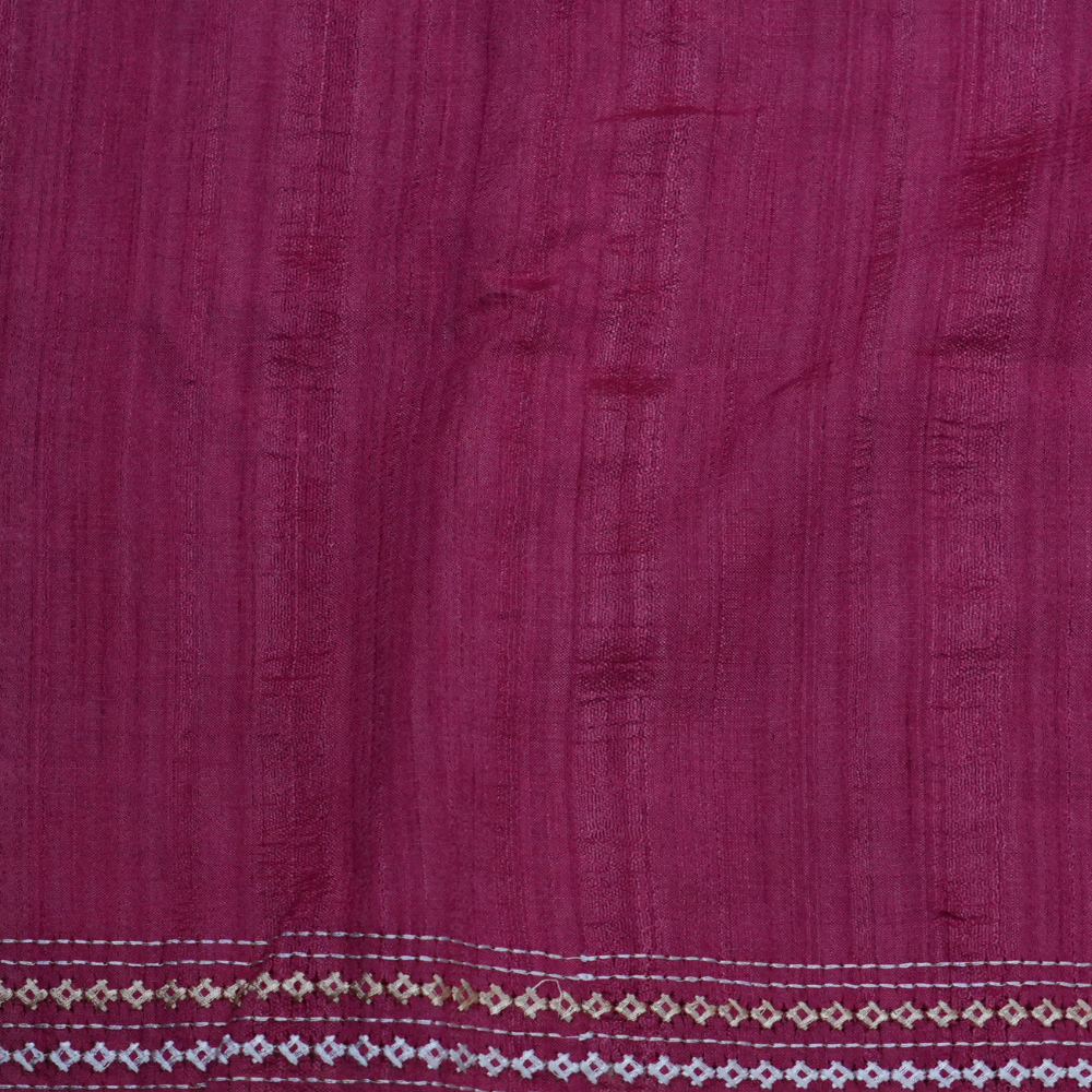 Elegant thread embroidered saree featuring rich Kutch work pallu and running blouse piece.
