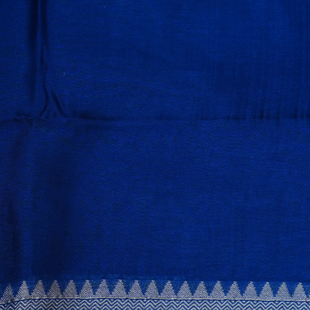 Elegant ethnic saree featuring rich floral Meenakari pallu and running blouse piece.
