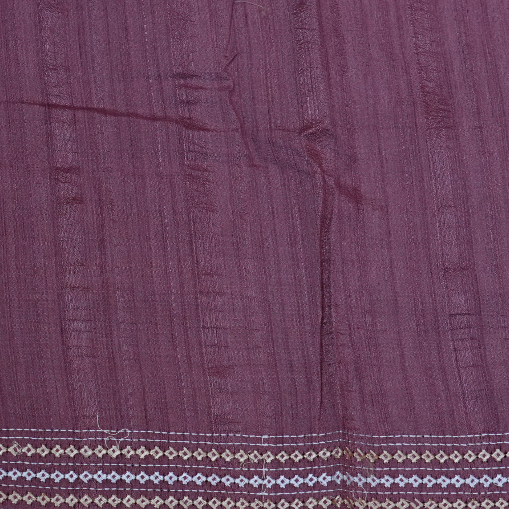 Elegant thread embroidered saree featuring rich Kutch work pallu and running blouse piece.
