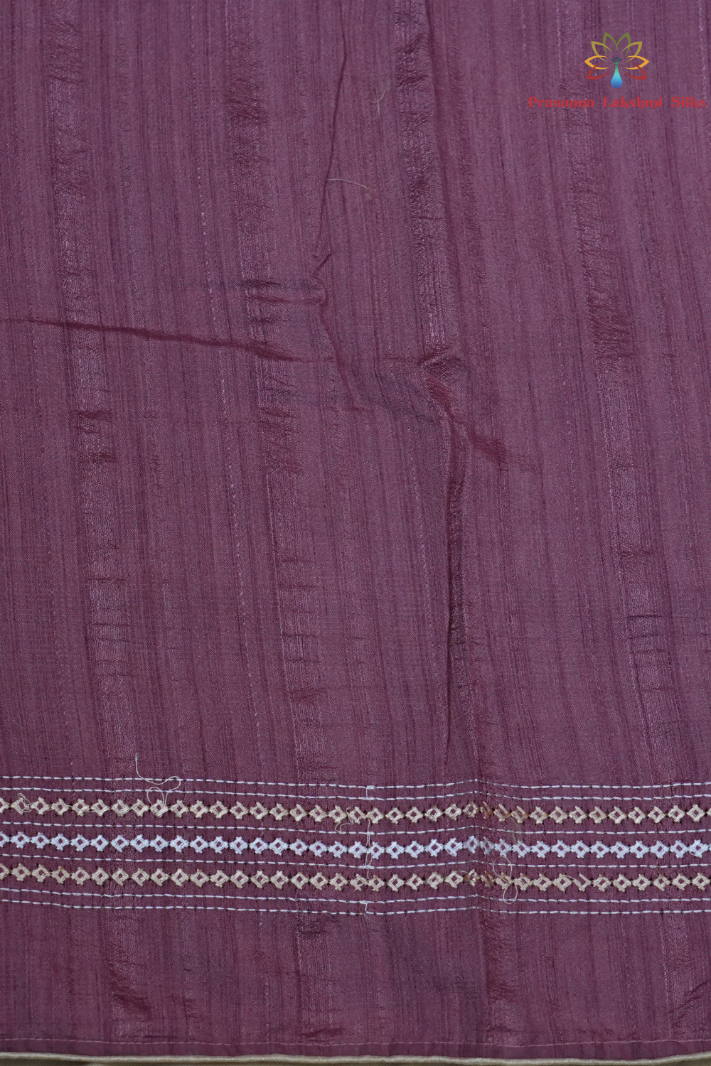 Elegant thread embroidered saree featuring rich Kutch work pallu and running blouse piece.

