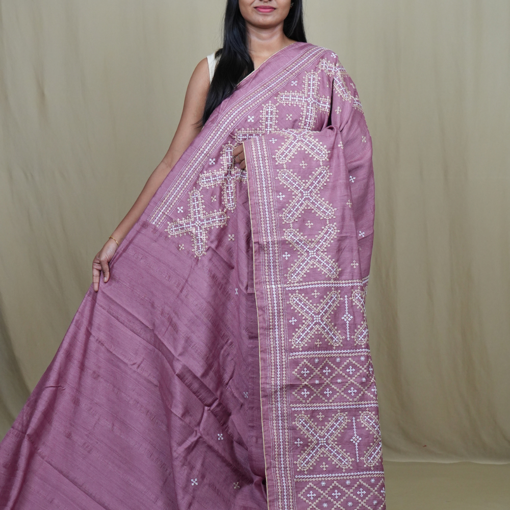 Semi Tussar silk saree with all-over small Kutch work motifs and beautiful borders.
