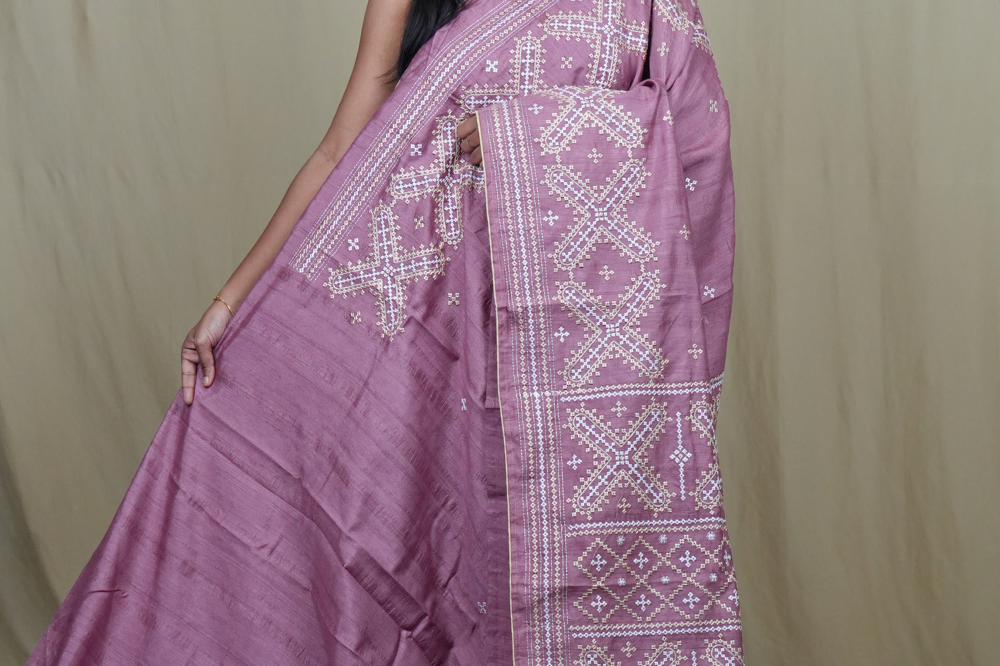 Semi Tussar silk saree with all-over small Kutch work motifs and beautiful borders.
