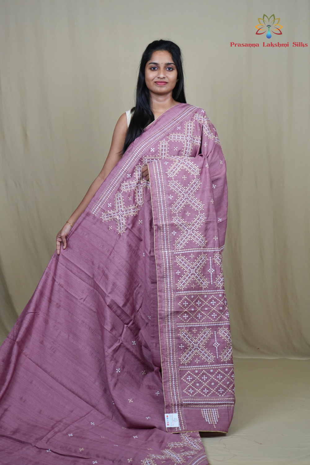 Semi Tussar silk saree with all-over small Kutch work motifs and beautiful borders.

