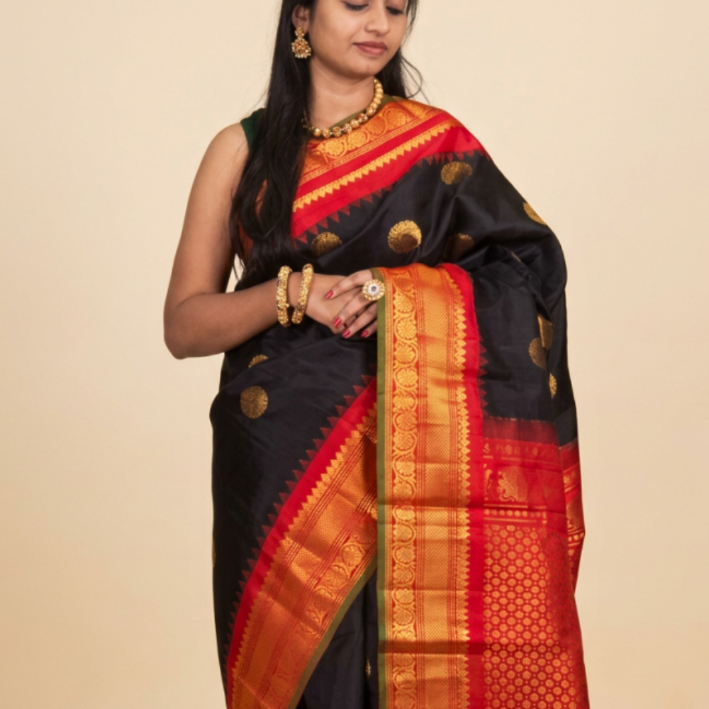Black Handloom Gadwal Pure Silk Saree with rich red zari woven border and brocade pallu
