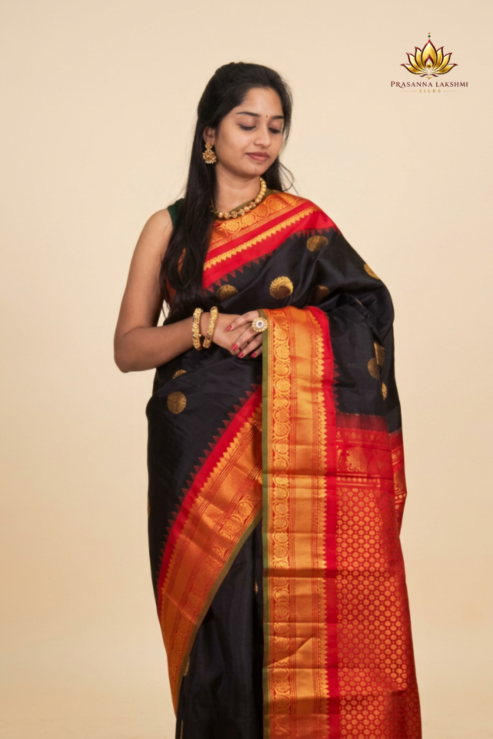 Black Handloom Gadwal Pure Silk Saree with rich red zari woven border and brocade pallu
