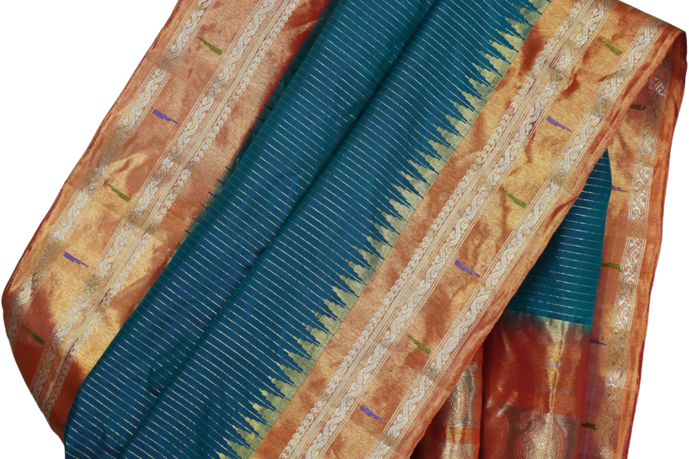 Handloom Gadwal pure tissue silk saree with intricate zari motifs and muniya borders.
