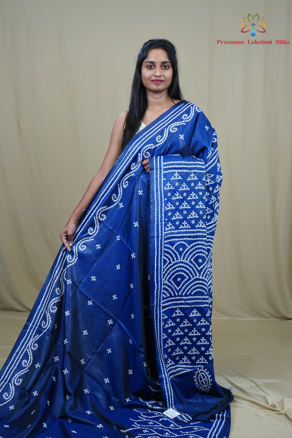 Semi Bangalore Silk Saree with all-over Kutch work motifs and rich embroidered pallu.
