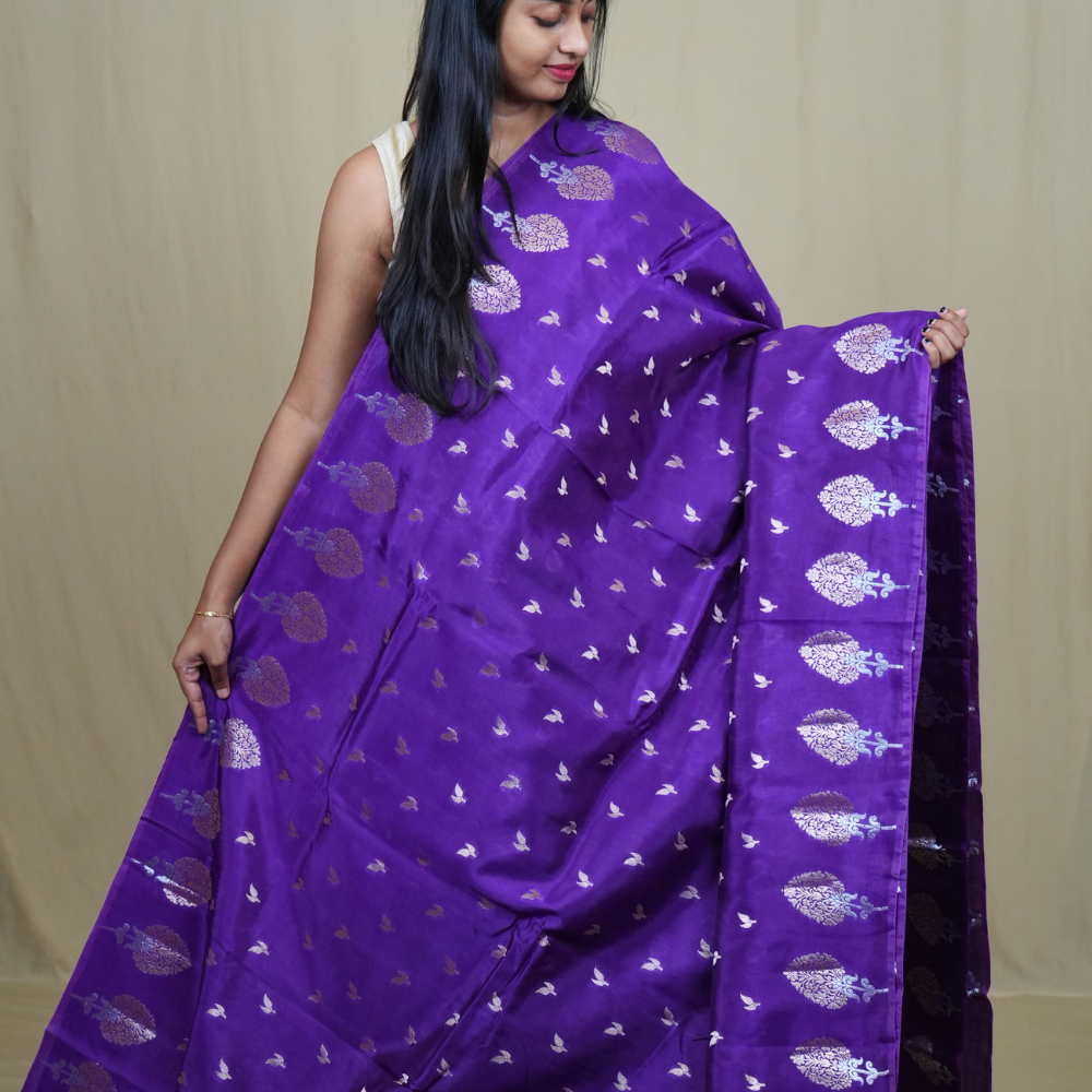 Traditional Banarasi silk saree featuring rich brocade pallu and matching brocade blouse.
