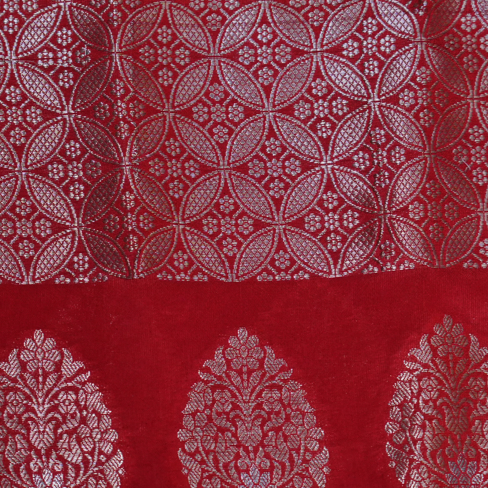 Elegant Banarasi Munga silk saree suitable for weddings and grand celebrations with intricate zari detailing.