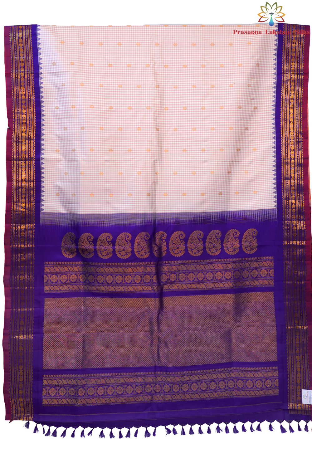 Traditional Gadwal silk saree featuring zari-woven borders and contrast blouse piece.
