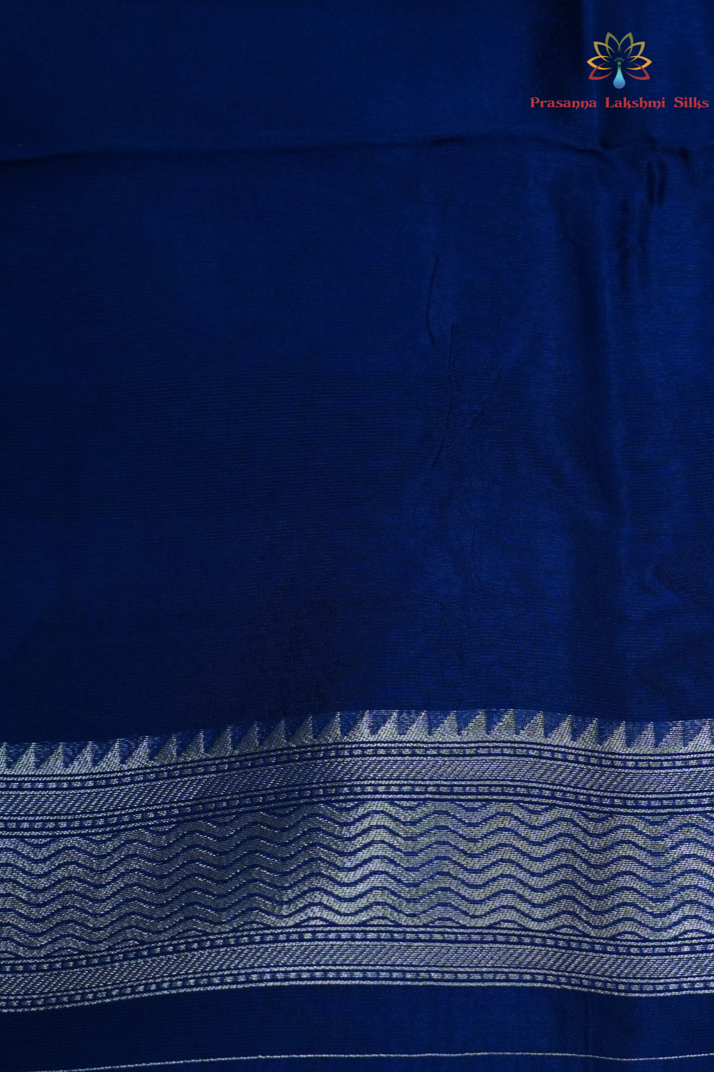 Elegant ethnic saree featuring rich floral Meenakari pallu and running blouse piece.
