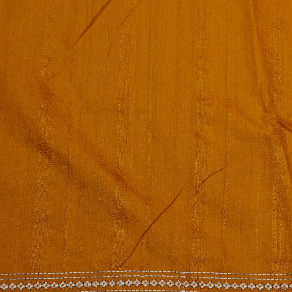 Elegant thread embroidered saree featuring rich Kutch work pallu and running blouse piece.
