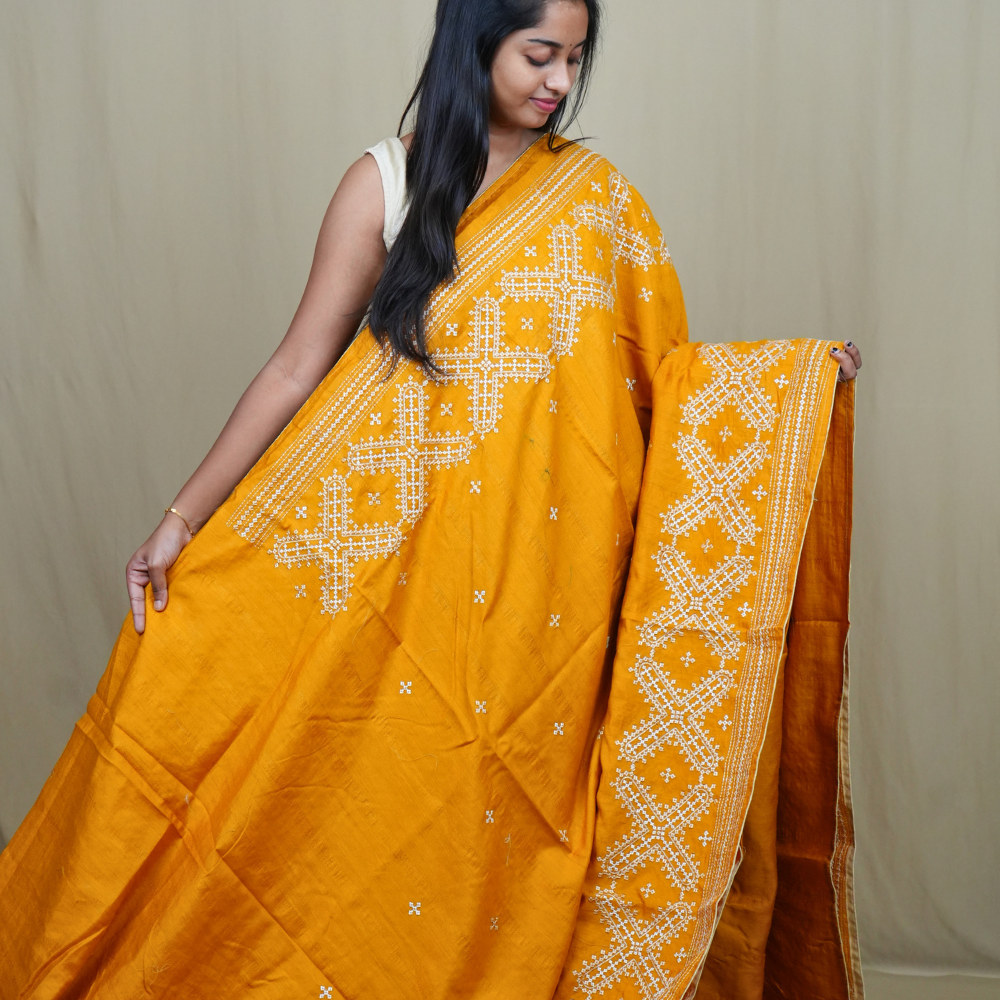 Traditional semi Tussar saree suitable for festive occasions with intricate Kutch work detailing.