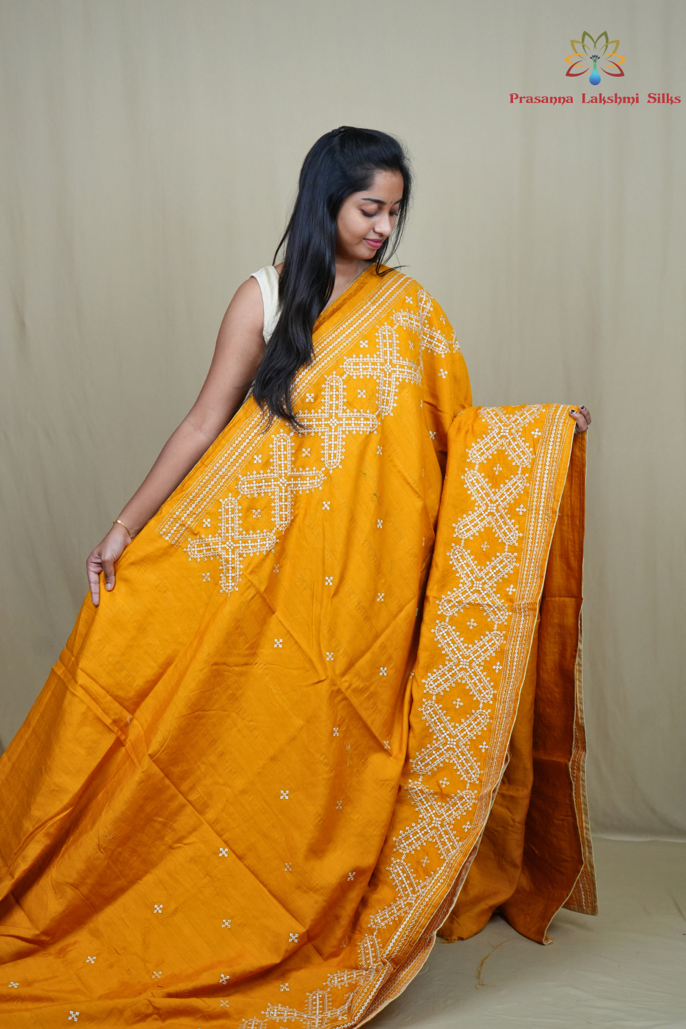 Traditional semi Tussar saree suitable for festive occasions with intricate Kutch work detailing.