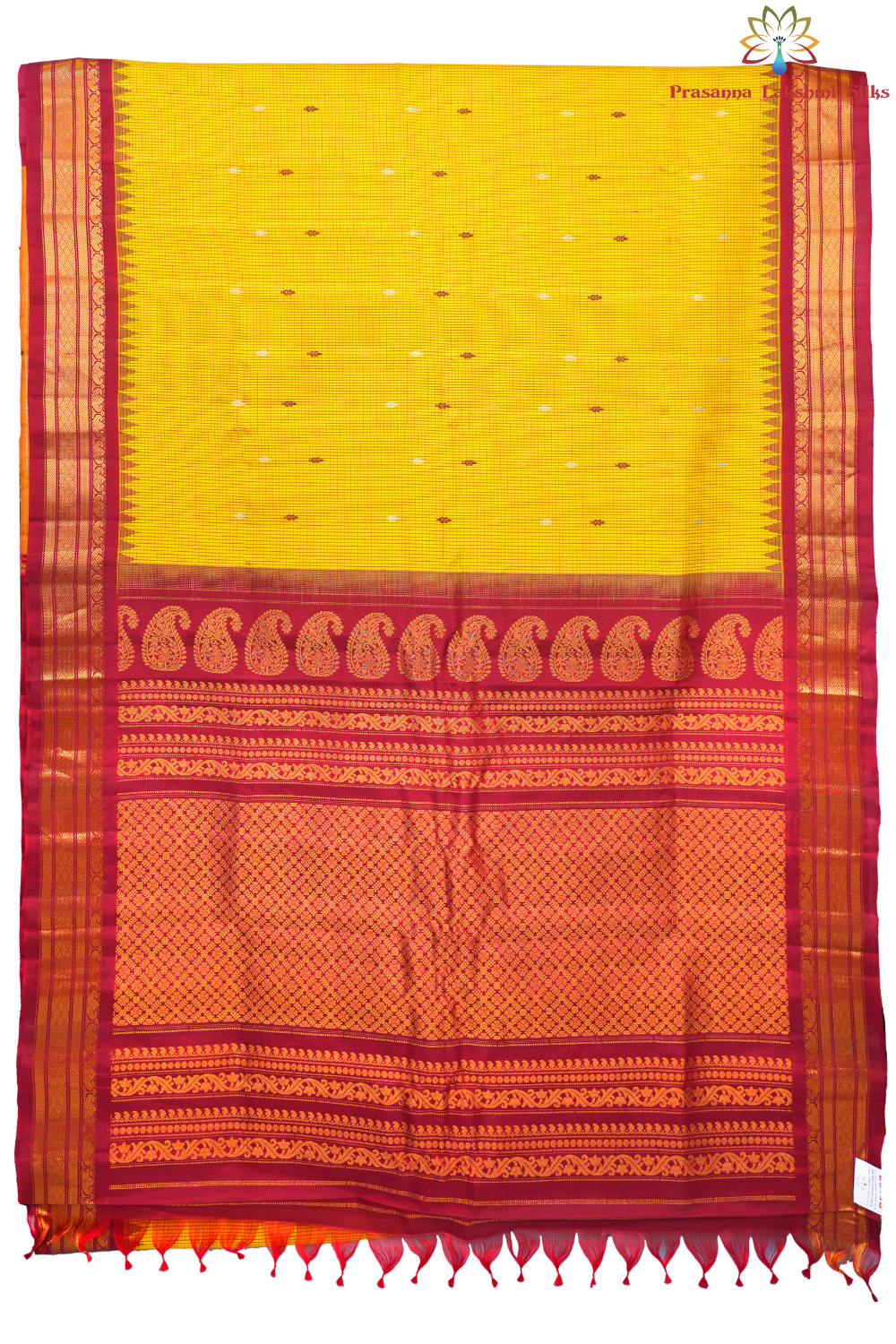 Traditional Gadwal silk saree featuring zari-woven borders and contrast blouse piece.
