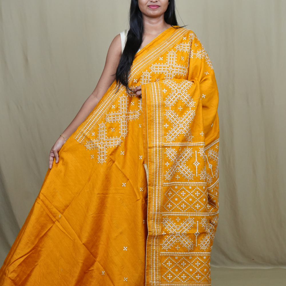 Semi Tussar silk saree with all-over small Kutch work motifs and beautiful borders.
