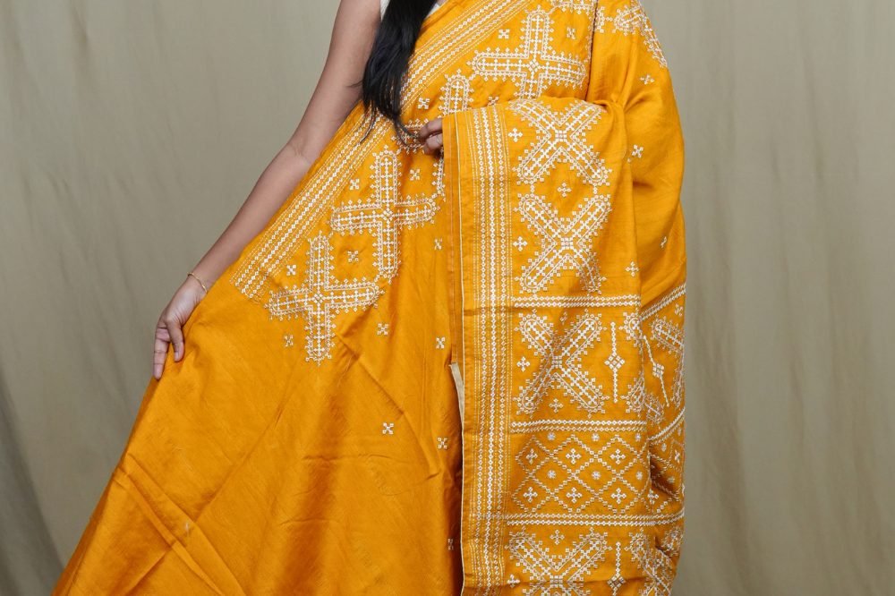 Semi Tussar silk saree with all-over small Kutch work motifs and beautiful borders.
