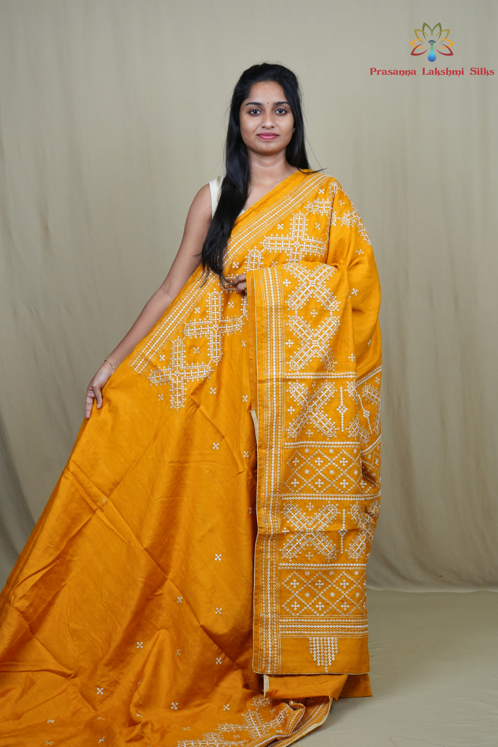 Semi Tussar silk saree with all-over small Kutch work motifs and beautiful borders.
