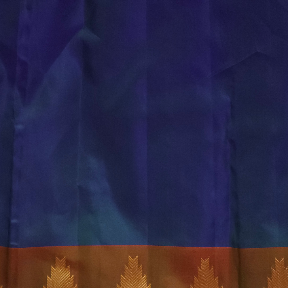 Premium Gadwal Silk Saree with woven zari motifs, luxurious brocade pallu, meenakari turning border, and matching contrast blouse.
