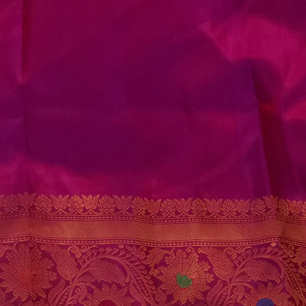 Premium Gadwal Silk Saree with woven zari motifs, luxurious brocade pallu, meenakari turning border, and matching contrast blouse.
