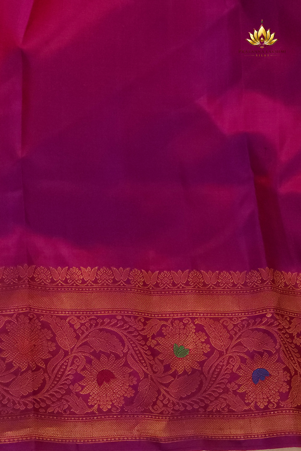 Premium Gadwal Silk Saree with woven zari motifs, luxurious brocade pallu, meenakari turning border, and matching contrast blouse.
