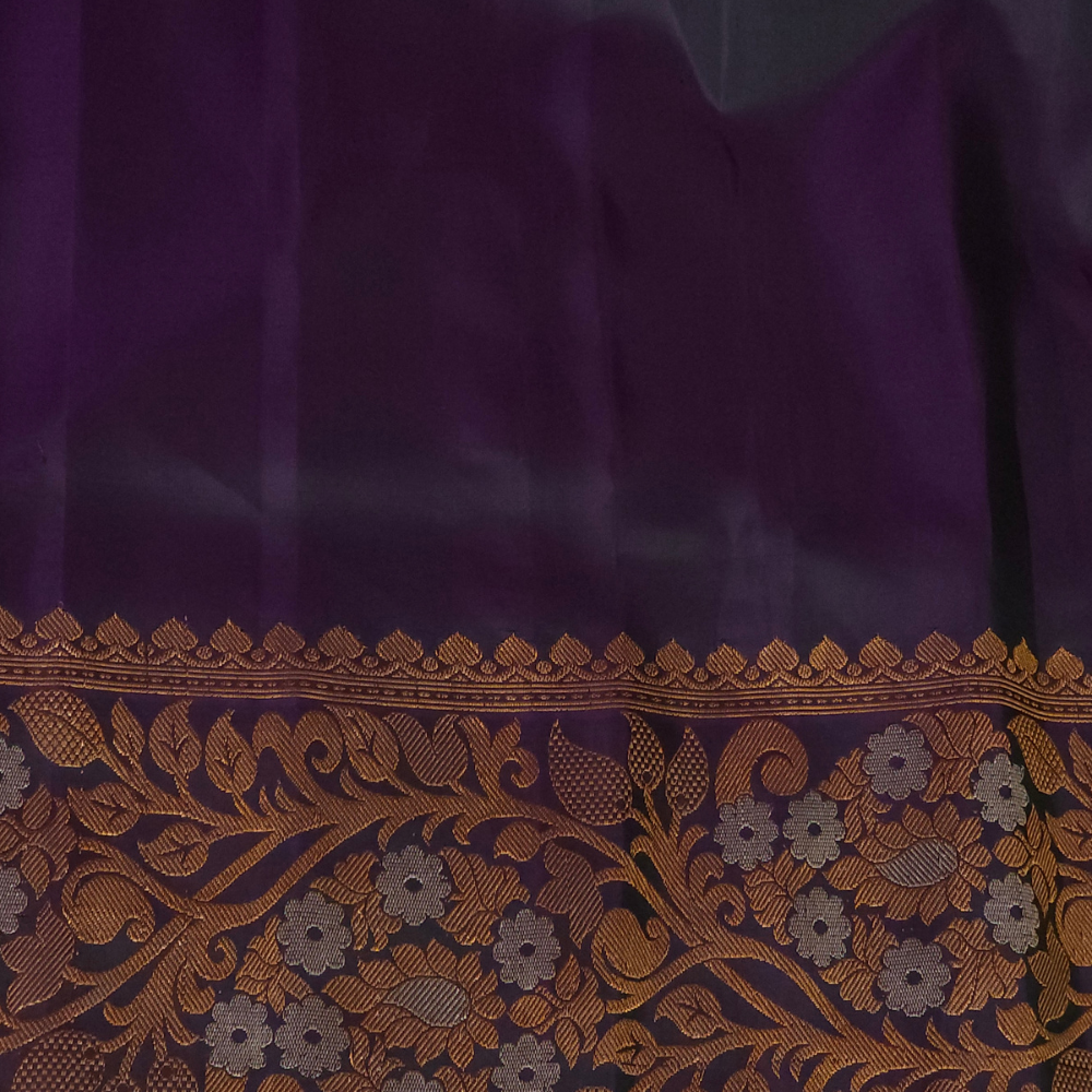 Premium Gadwal Silk Saree with woven zari motifs, luxurious brocade pallu, meenakari turning border, and matching contrast blouse.
