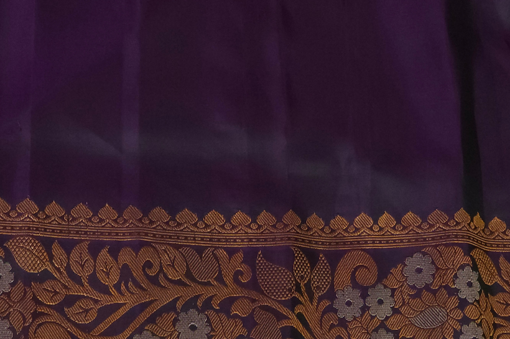 Premium Gadwal Silk Saree with woven zari motifs, luxurious brocade pallu, meenakari turning border, and matching contrast blouse.
