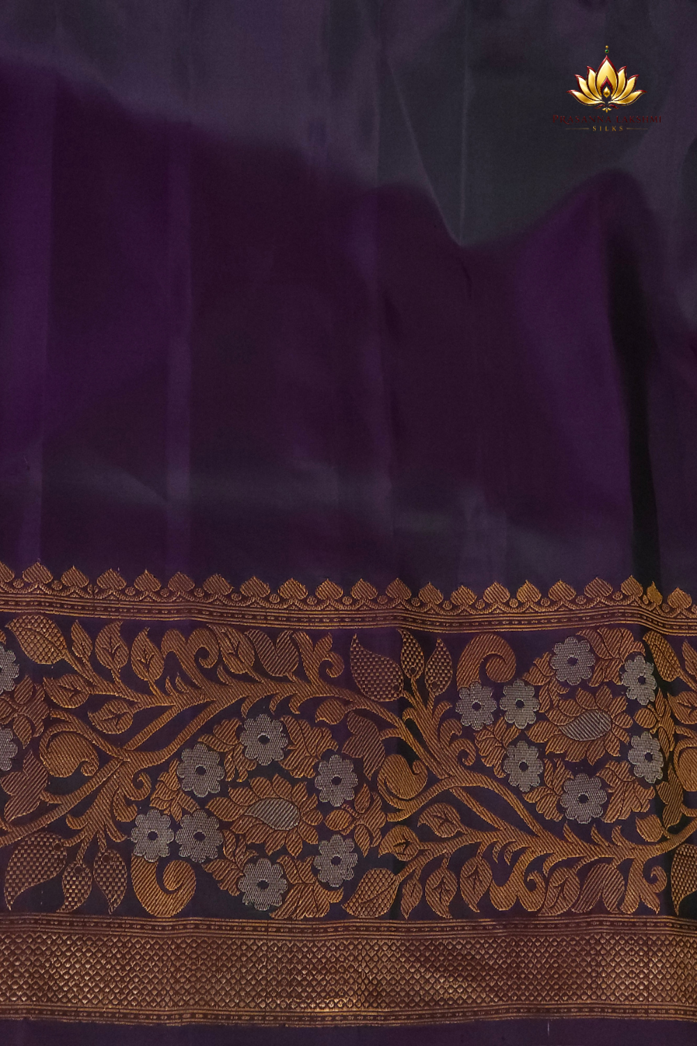 Premium Gadwal Silk Saree with woven zari motifs, luxurious brocade pallu, meenakari turning border, and matching contrast blouse.

