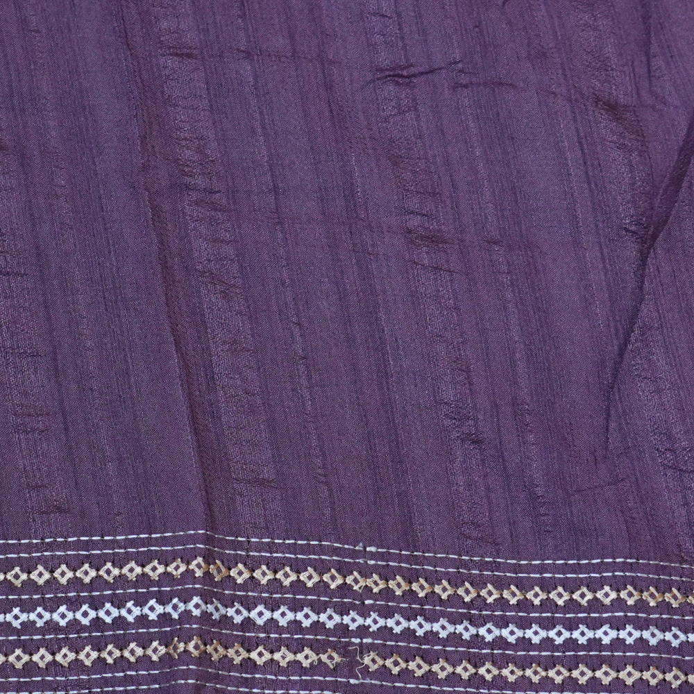 Elegant thread embroidered saree featuring rich Kutch work pallu and running blouse piece.
