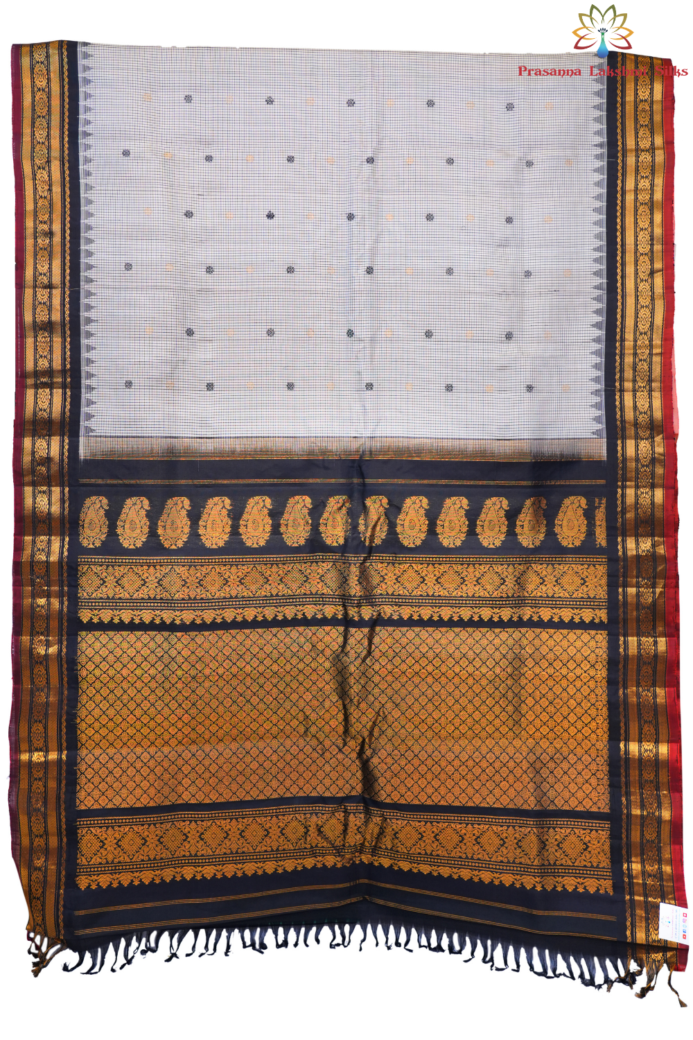 Traditional Gadwal silk saree featuring zari-woven borders and contrast blouse piece.
