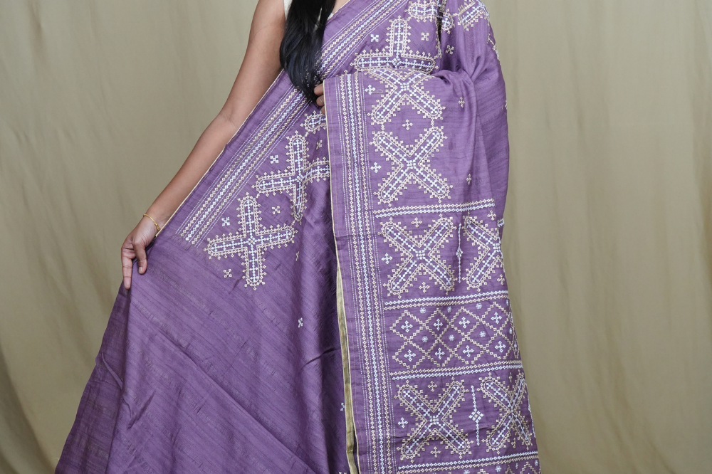 Semi Tussar silk saree with all-over small Kutch work motifs and beautiful borders.
