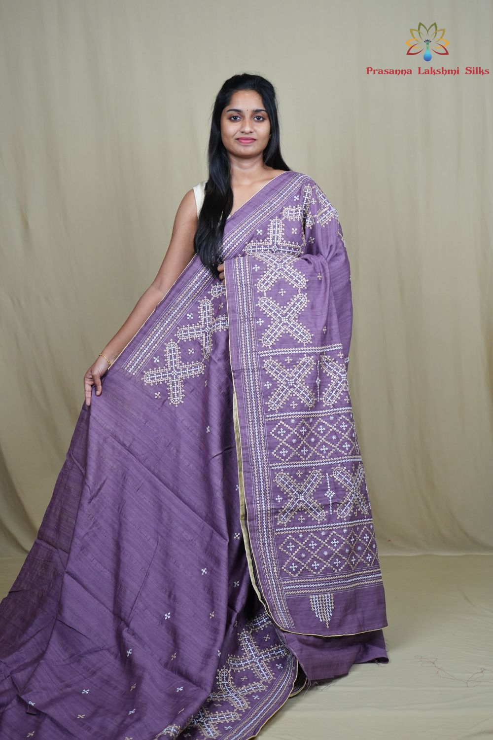 Semi Tussar silk saree with all-over small Kutch work motifs and beautiful borders.
