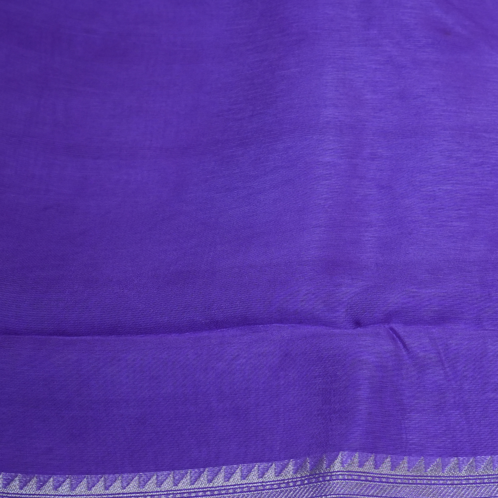 Elegant ethnic saree featuring rich floral Meenakari pallu and running blouse piece.
