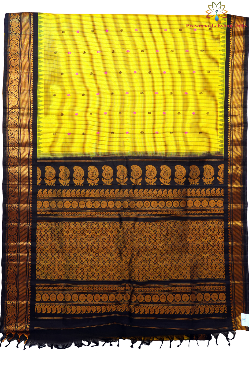 Traditional Gadwal silk saree featuring zari-woven borders and contrast blouse piece.
