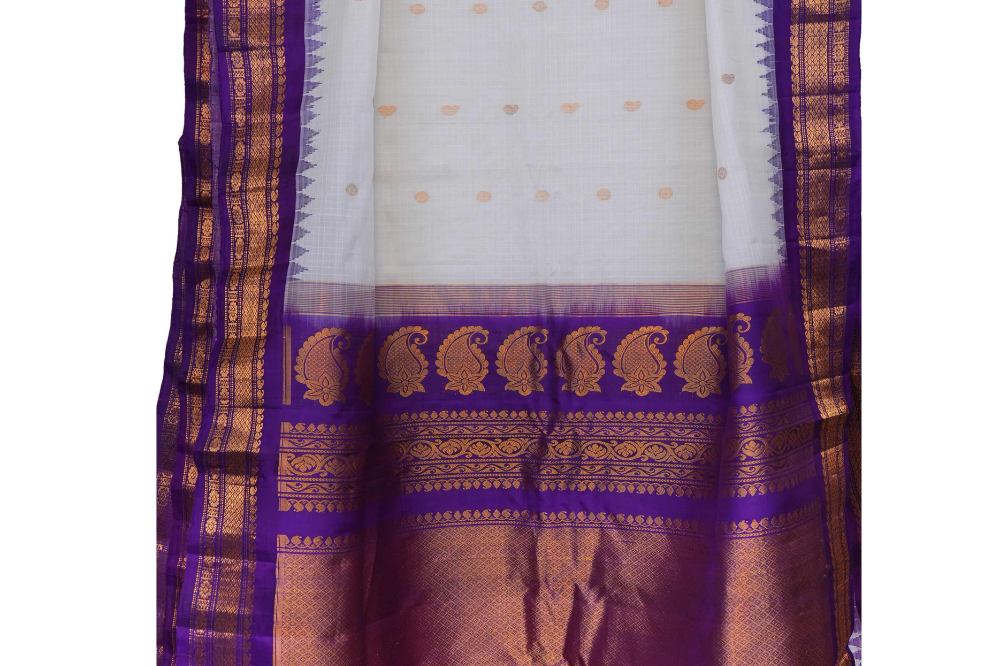 Traditional Gadwal SiCo saree featuring exquisite zari woven borders and blouse piece.
