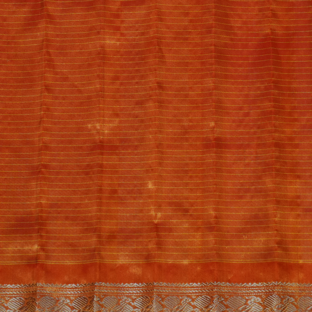 Elegant Gadwal tissue silk saree featuring brocade tissue pallu and contrast blouse.
