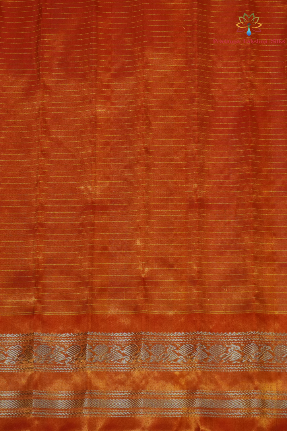 Elegant Gadwal tissue silk saree featuring brocade tissue pallu and contrast blouse.
