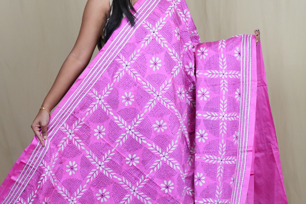 Elegant silk saree featuring Kantha work borders and detailed Kantha pallu design.
