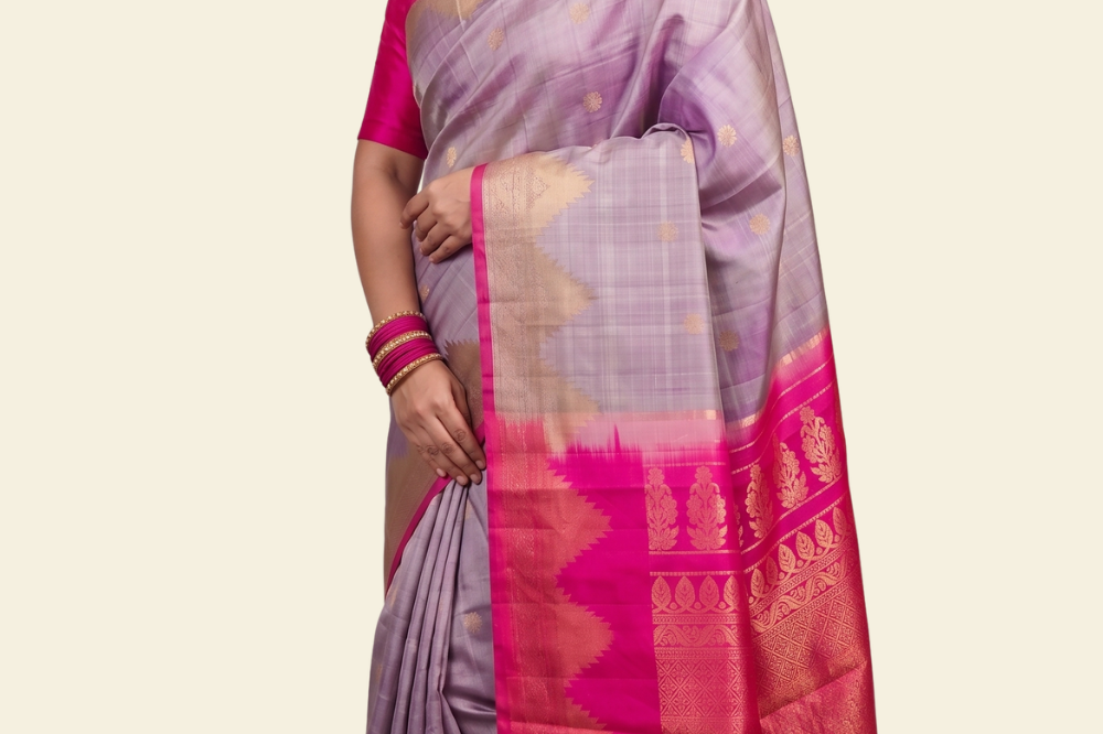 Pure handloom Gadwal silk saree with all-over zari motifs and intricate turning borders
