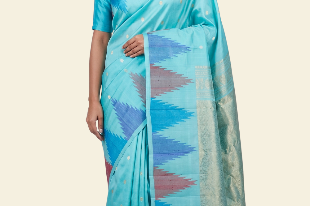 Pure handloom Gadwal silk saree with all-over zari motifs and intricate turning borders
