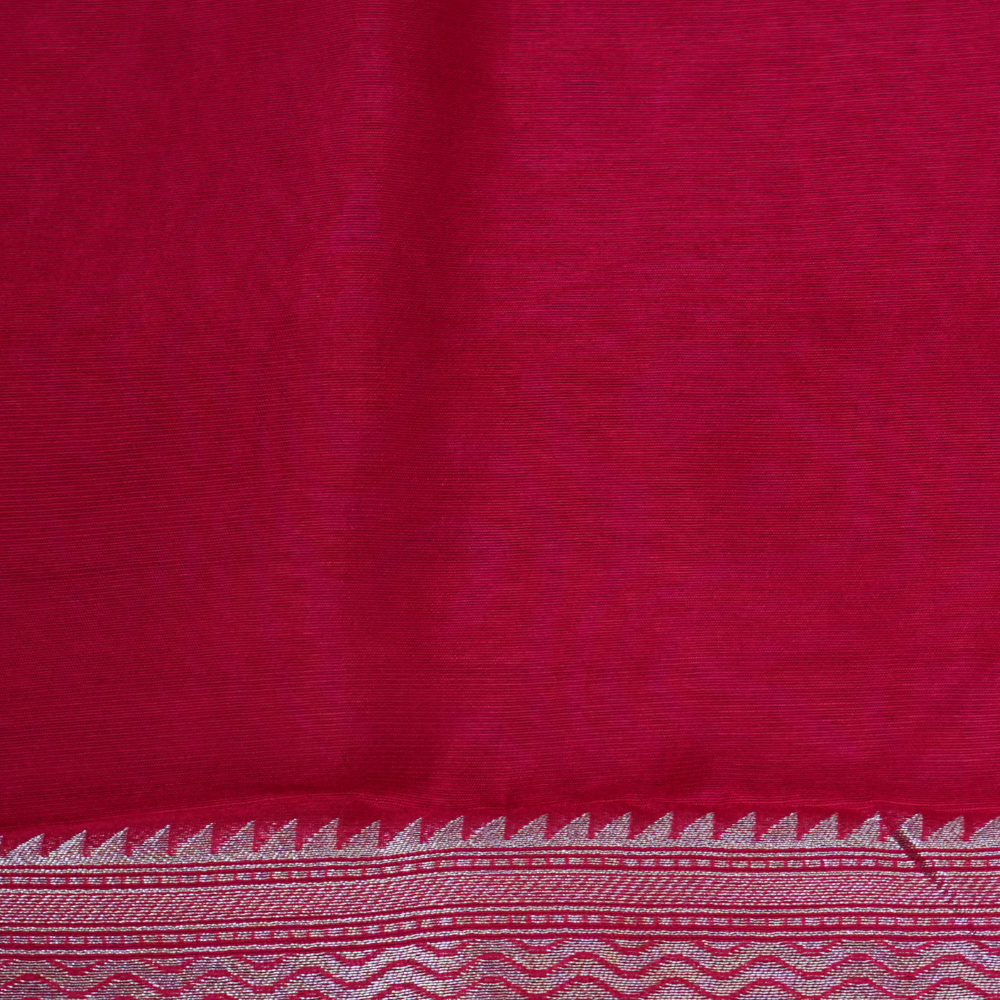 Elegant ethnic saree featuring rich floral Meenakari pallu and running blouse piece.
