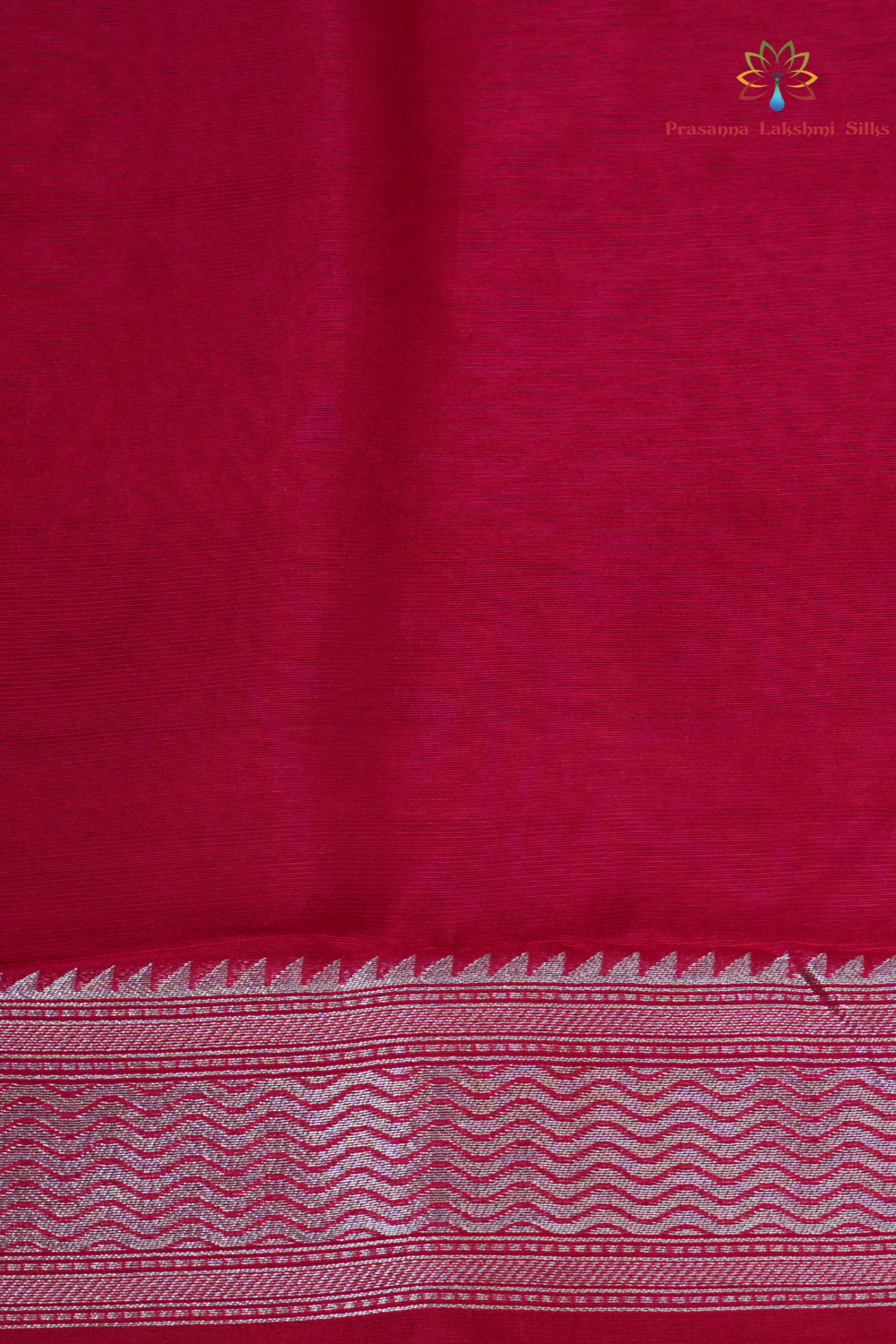 Elegant ethnic saree featuring rich floral Meenakari pallu and running blouse piece.
